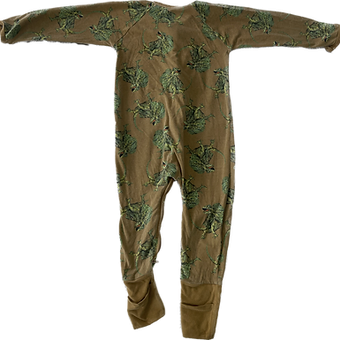 Back side of dinosaur print onesie showing full coverage and print detail