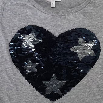 Close-up of reversible sequin design on girls top