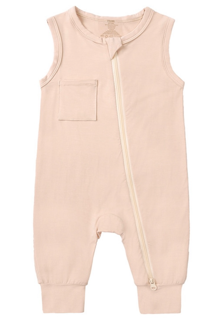 Beloved Bubs sleeveless bamboo romper in soft cloud pink, flat lay front view – lightweight, breathable fabric with zipper for easy dressing.
