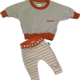 Bonds Baby Burnt Orange Jumper & Pants Set – Cozy Beige and Orange Two-Piece Outfit with Oversized Sweatshirt and Striped Leggings for Babies and Toddlers.