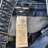 Close-up of snap access feature on kids' denim jeans