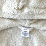 Close-up of plush fabric and bear ear hood on Baby Gap bathrobe