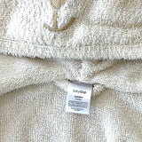 Close-up of plush fabric and bear ear hood on Baby Gap bathrobe
