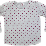Front view of boat-neck polka dot long sleeve dress by Seed