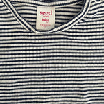 Close-up of navy white striped baby top with soft fabric