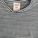 Close-up of navy white striped baby top with soft fabric