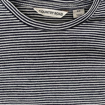 Size 6 girls long sleeve navy striped top laid flat