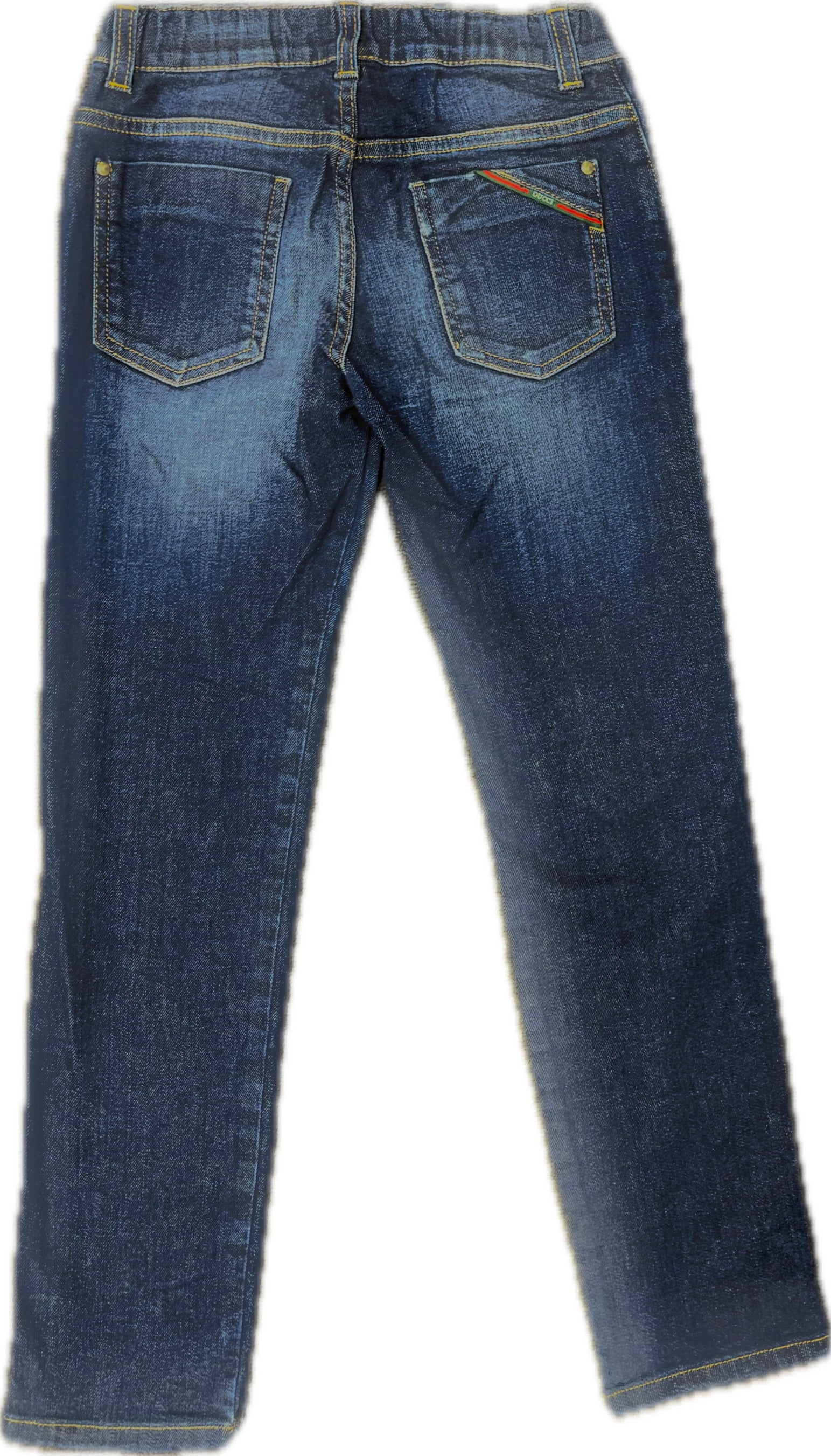 Gucci brand tag and waistband detail on kid's denim jeans