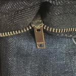 Folded Gucci kids' jeans showing straight-leg cut and fabric