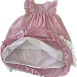 Close-up of gingham detail on Laura Ashley girls pink dress
