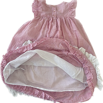 Close-up of gingham detail on Laura Ashley girls pink dress