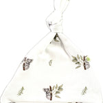 Front view of the newborn organic koala beanie with top-knot.