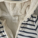 Close-up of soft striped fabric on H&M newborn jacket